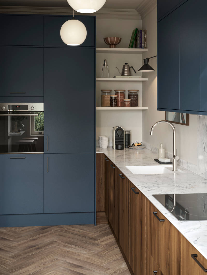 Contemporary Ascoli Mineral Blue tall cabinets and wall cabinets over Portobello Umbra kitchen cabinets with marbled compact laminate worktop, black handles and Amtico smouldered oak herringbone flooring.