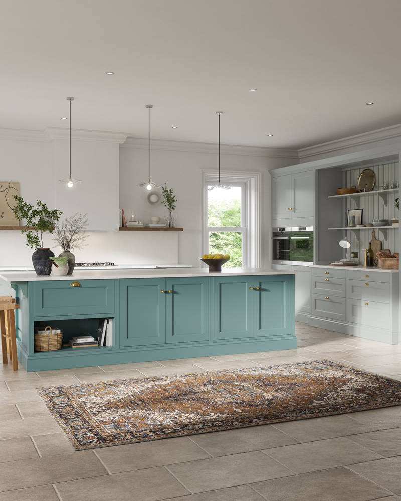 Traditional Shaker-style kitchen range in light grey with a blue kitchen island.