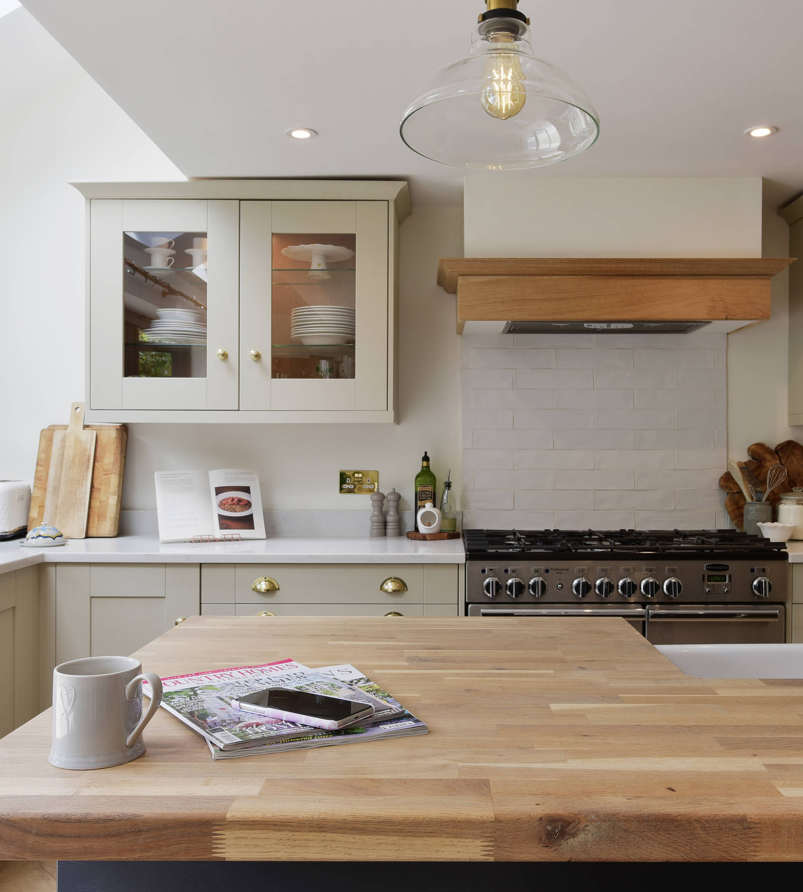 View from the kitchen island of the cabinets with antique brass cup handles.
