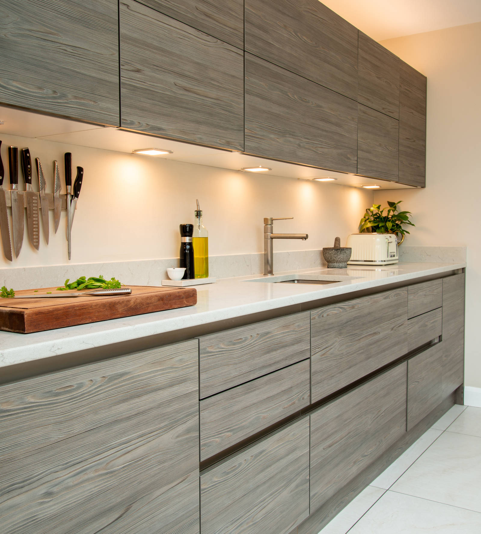 Angled view of kitchen counter and wall cabinets in Integra Ascoli
