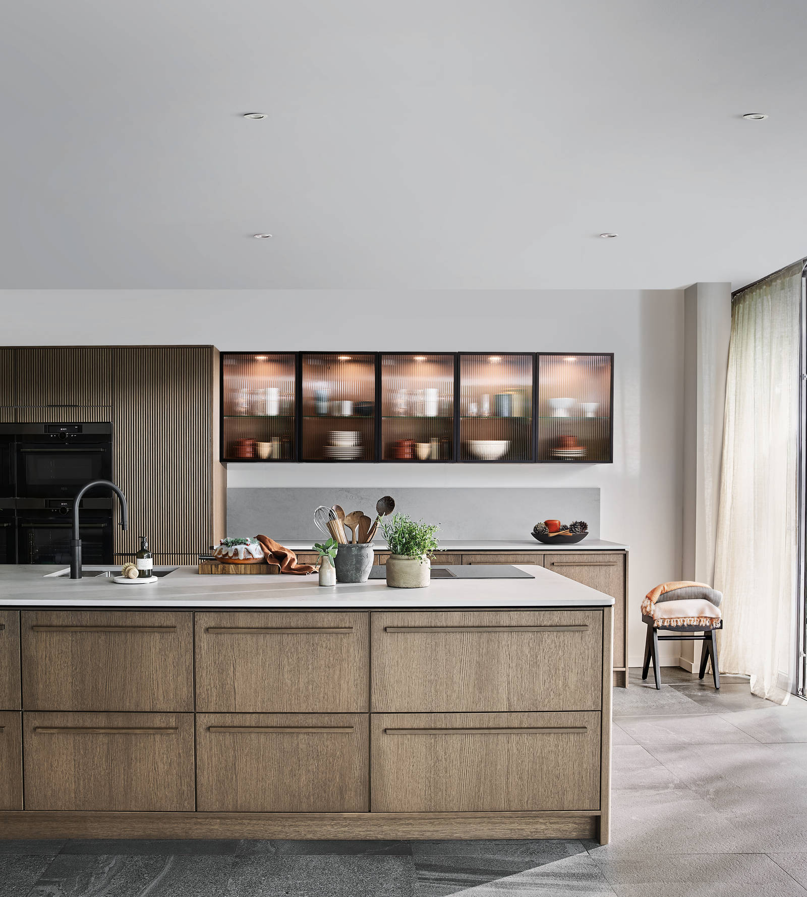 Nordic Nature. Modern wooden kitchen design with a Nordic influence. Featured floating worktops, a ribbed plinth and rounded end panels