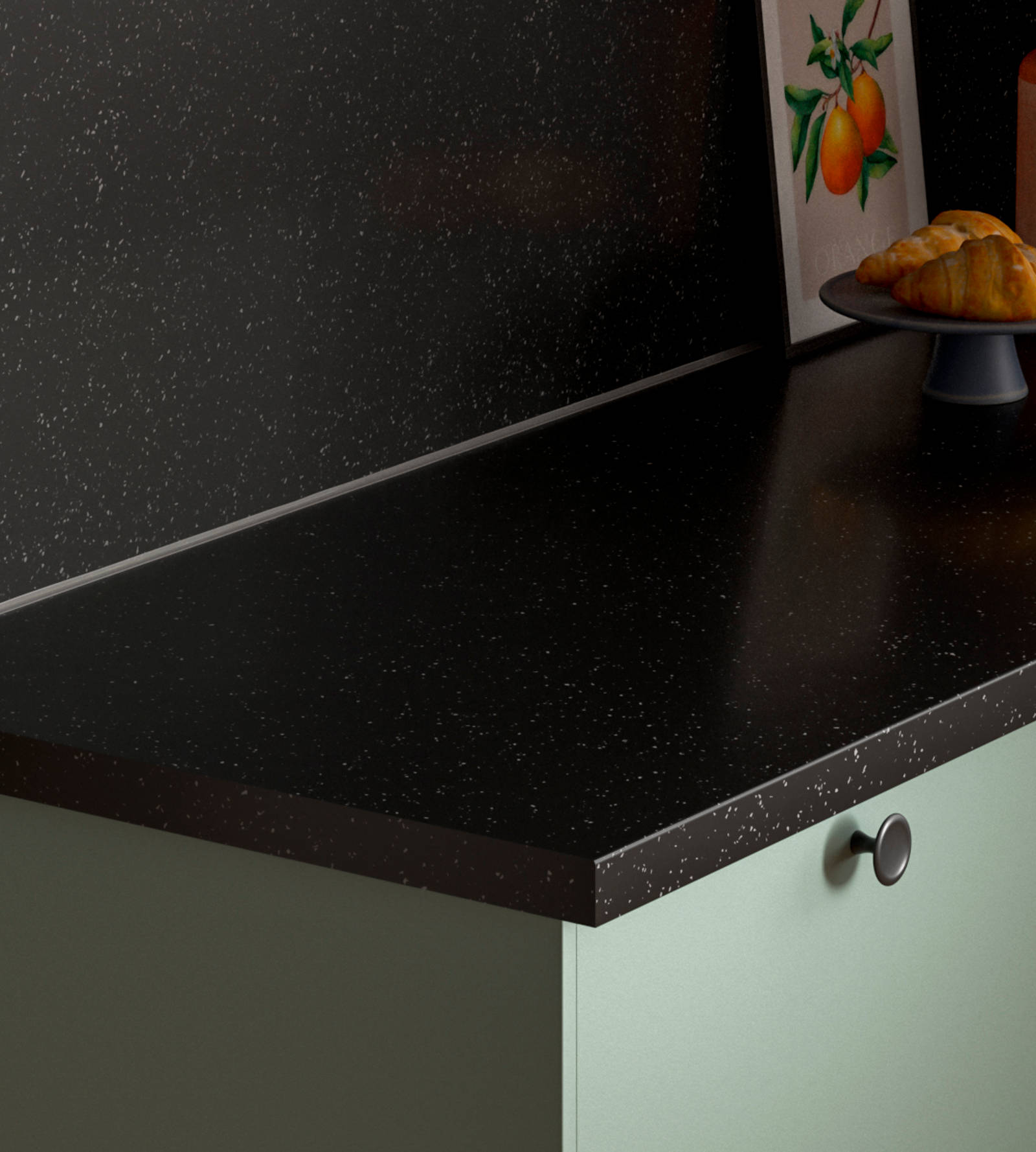 Black Granite worktop in Soho Seagrass kitchen from Magnet