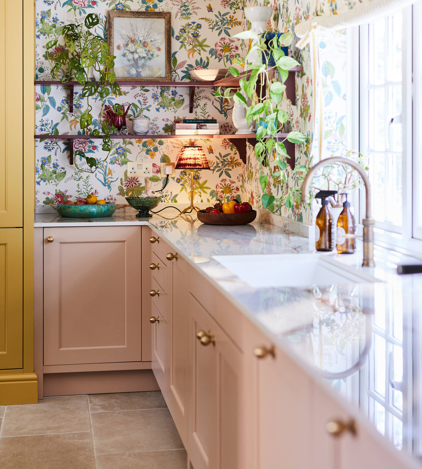 View of open shelving, with colourful decorations and plants.