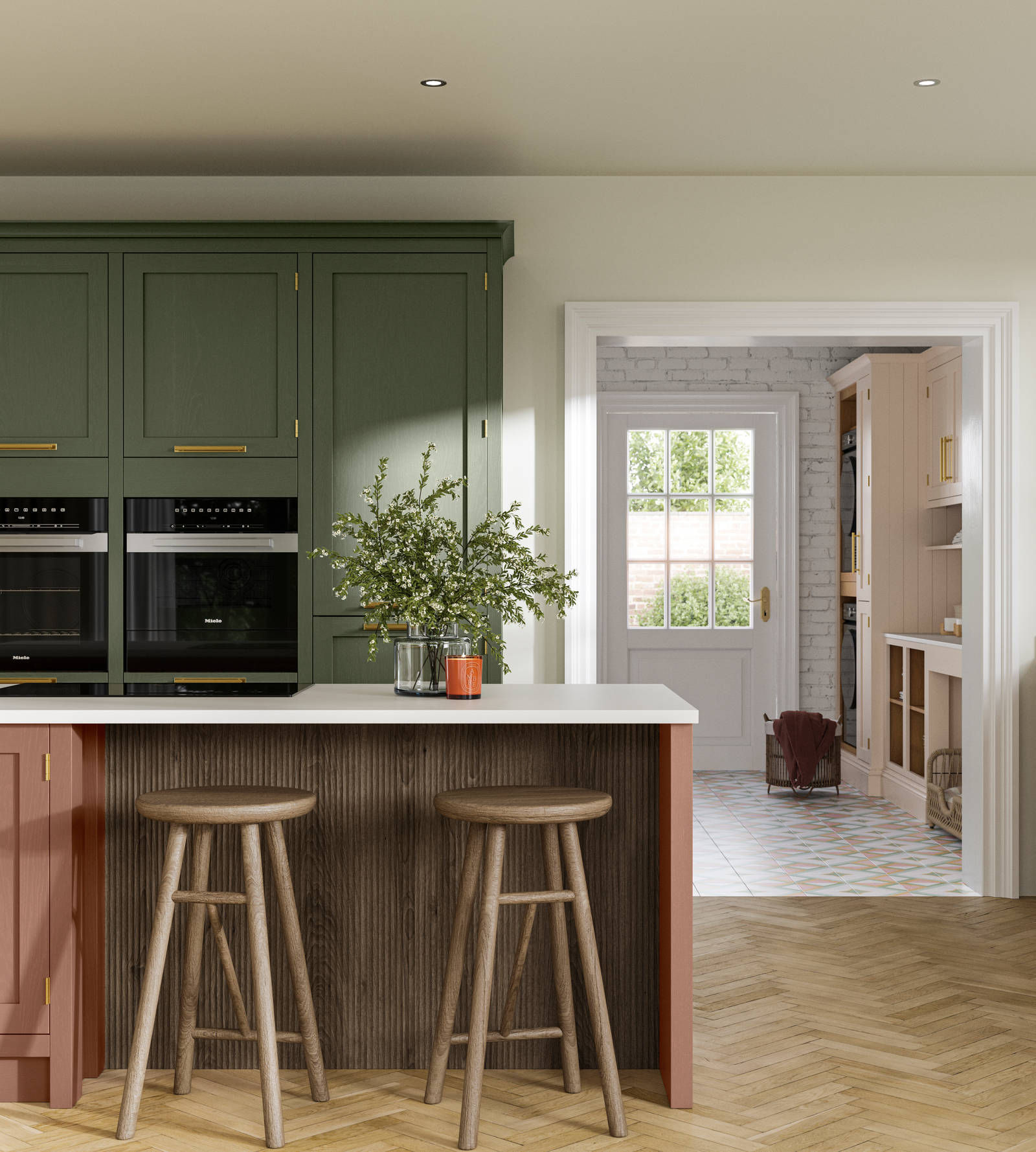 Tall Wardley kitchen cabinets  with built-in ovens, a kitchen island in shade Clay with wooden panelling by seating area and matching wooden bar stools.