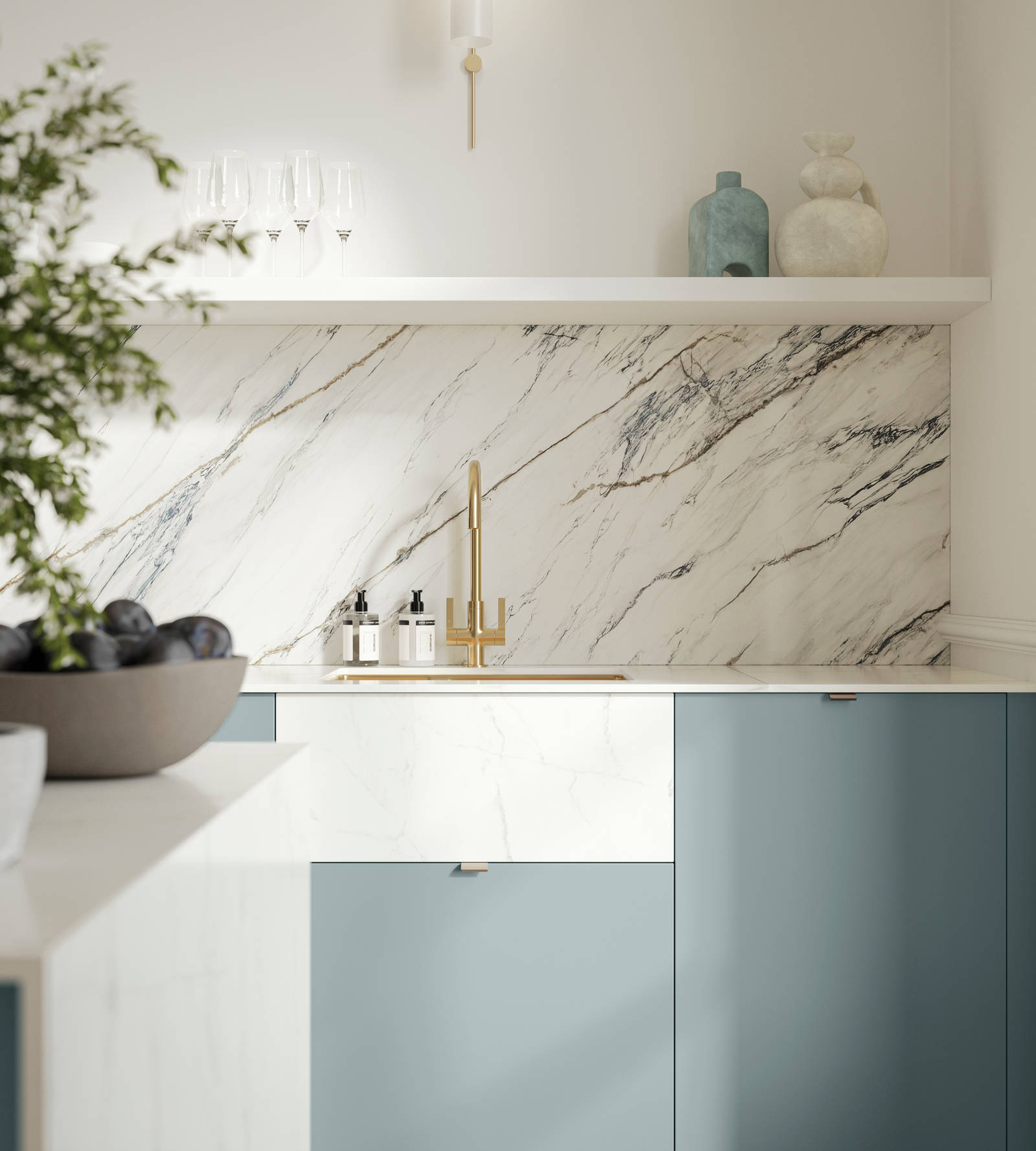 Soho Duck Blue kitchen from Magnet with white marble splashblack, paired beautifully with a bright brass tap and sink.