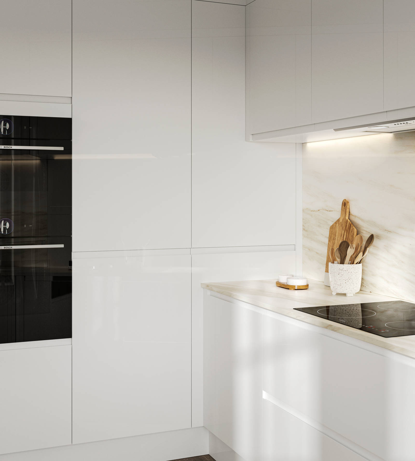 Handleless white gloss Luna kitchen from Magnet, with built-in ovens in tall cabinets.