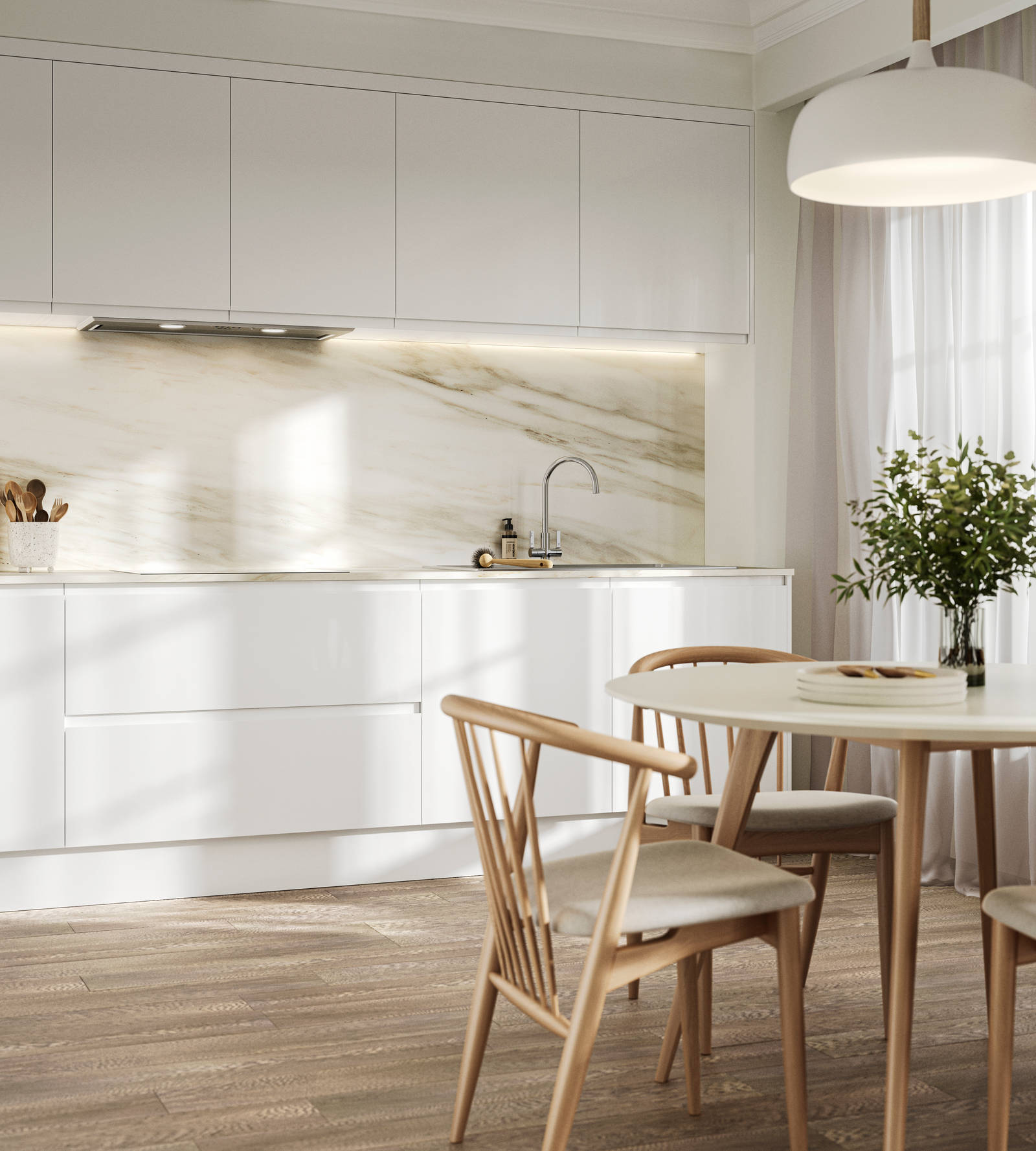Handleless white gloss Luna kitchen from Magnet, a round wooden kitchen table with matching chairs in foreground