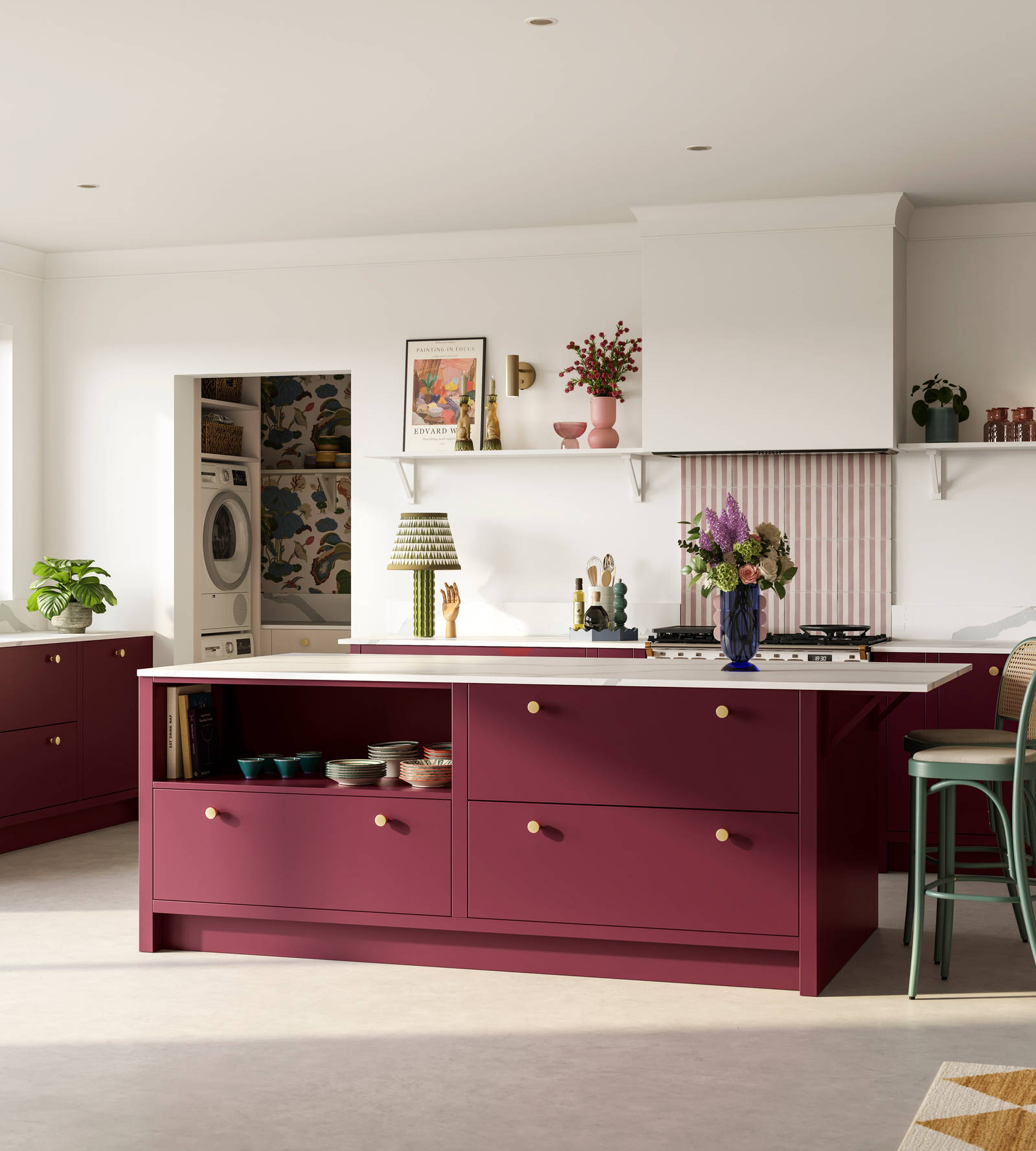 Modern slab front Soho Morello kitchen, kitchen island with rattan bar stools at breakfast bar, Bianco calacatta worktop and upstand, brass knobs and open shelf in kitchen island holding eclectic eramics, utility room with matching Soho cabinetry in the shade  Shell.