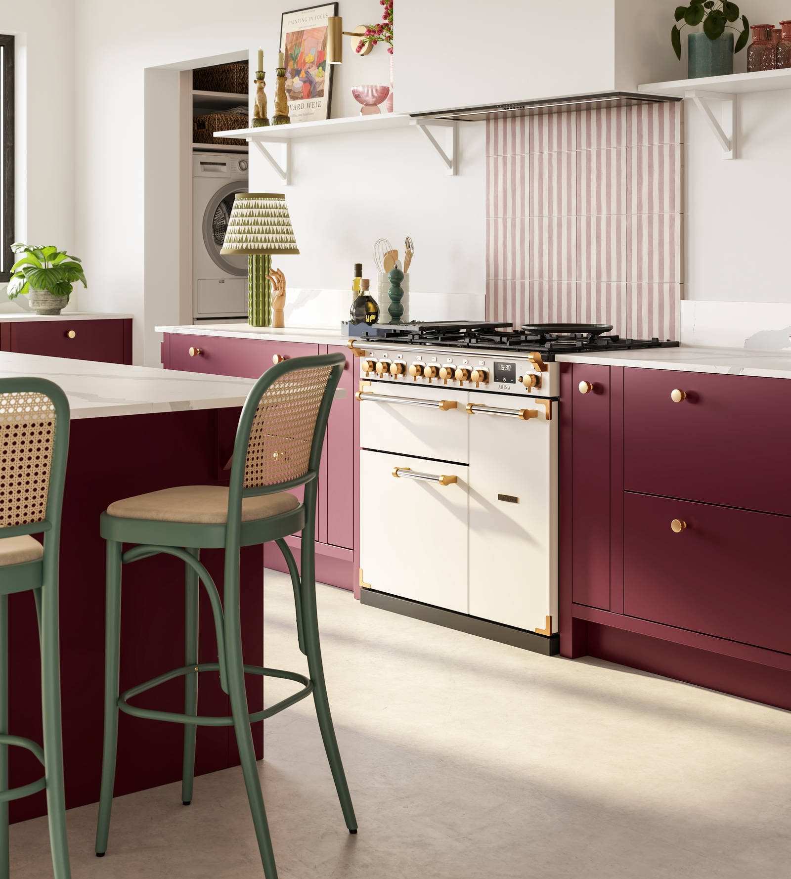 Modern slab front Soho Morello kitchen. kitchen island with rattan bar stools at breakfast bar, Bianco calacatta worktop and upstand, brass knobs and Otto tiles dirty pink stripes as splashback behind range cooker.