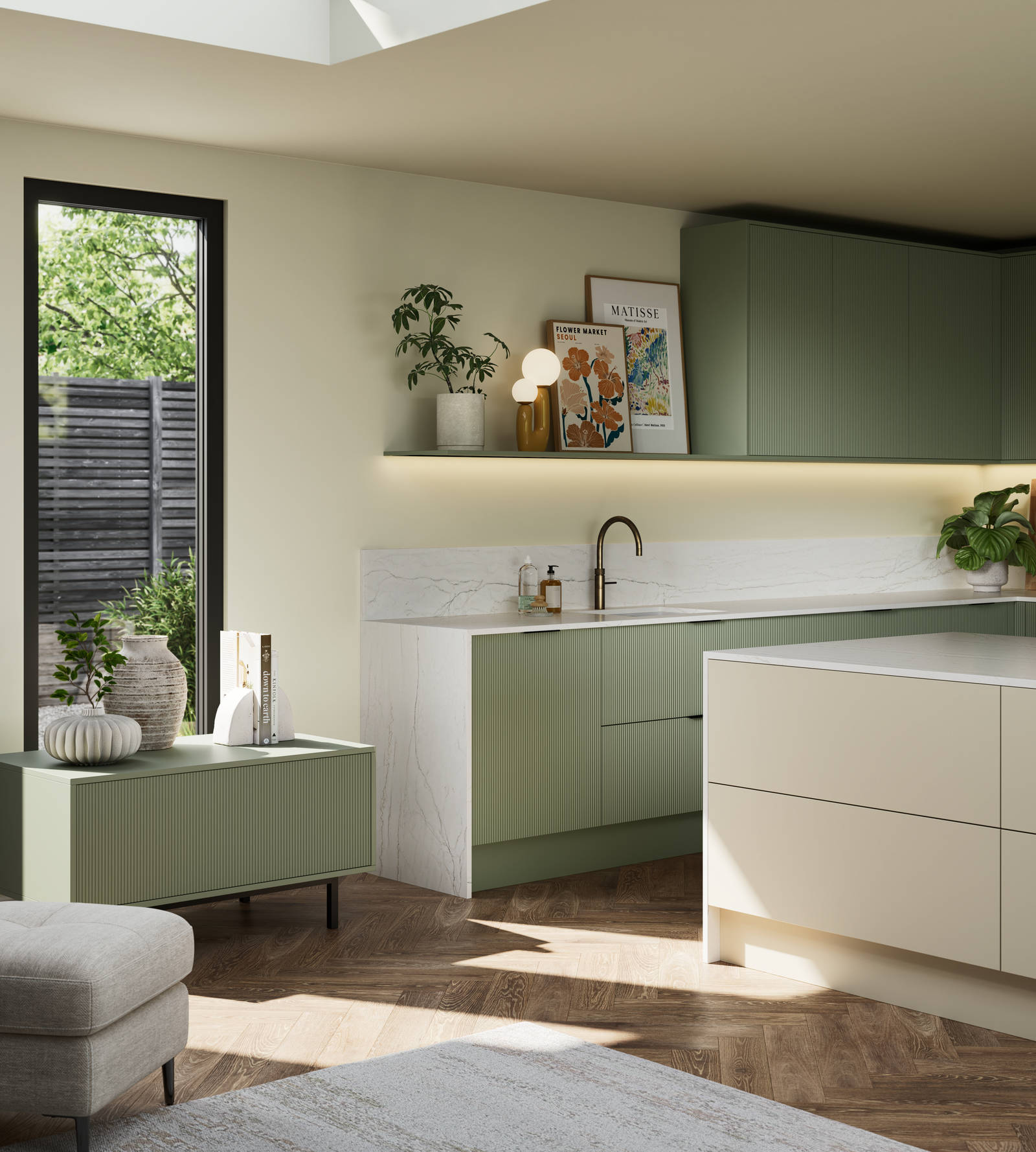 Green fluted kitchen fronts on tall cabinets with built-in appliances and black handles, light neutral shade handleless kitchen island and green sideboard on metal legs.