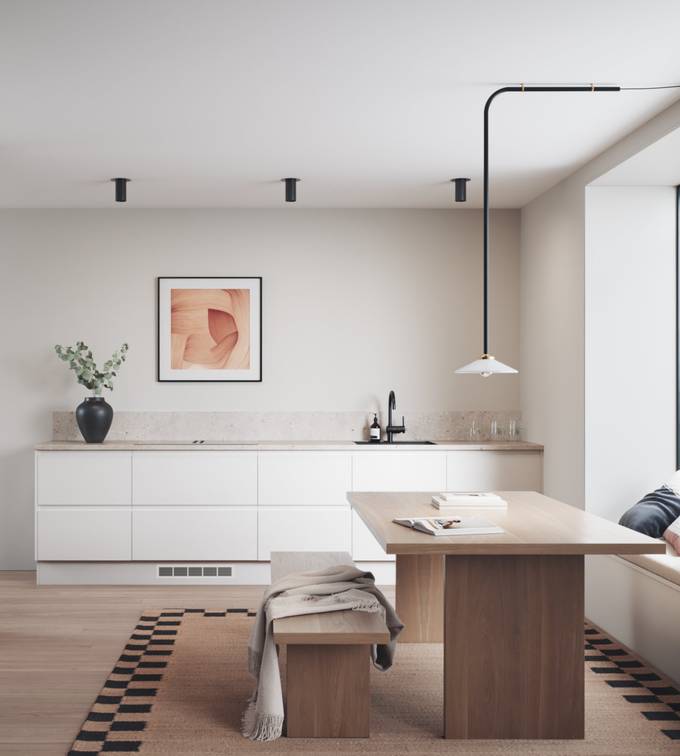 Hvit kjøkken med integrerte grep før en innredninsløsning som er lineær og grafisk velskapt.