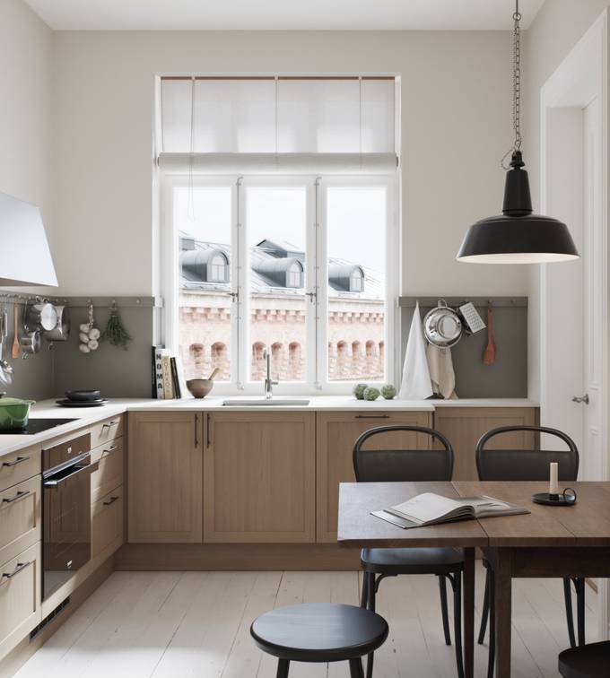 Nærbild på modern og lekker kjøkkenmodell i mdf med smal ramme og vakker eikestruktur,med Corian Glacier white benkeplate, håndtak i sort støpejern og kran i rustfritt stål.