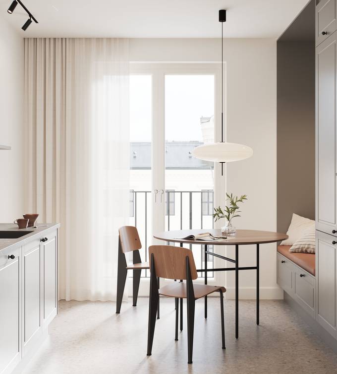 Ajaton ja moderni keskiharmaa keittiö, jossa jyrsityt peiliovet, jotka antavat keittiöön klassisia yksityiskohtia olematta rustiikkia, mustat nupit, musta hana ja musta pesuallas.