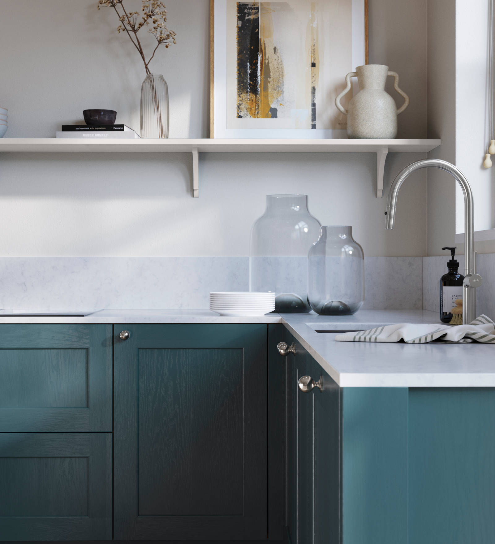 Ludlow, a traditional Shaker-style premium feel kitchen range with a visible woodgrain on its panelled doors here shown in the shade Carrington Blue styled with steel knobs, steel tap, a white marbled worktop with matching splashback.