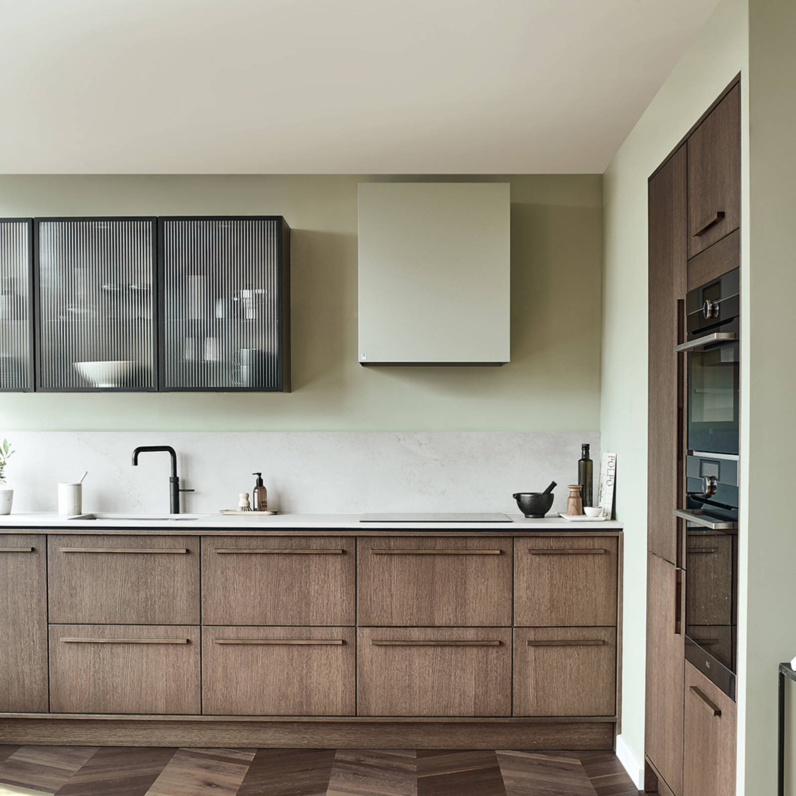 Nordic Nature. Modern wooden kitchen design with a Nordic influence. Featured floating worktops, a ribbed plinth and rounded end panels