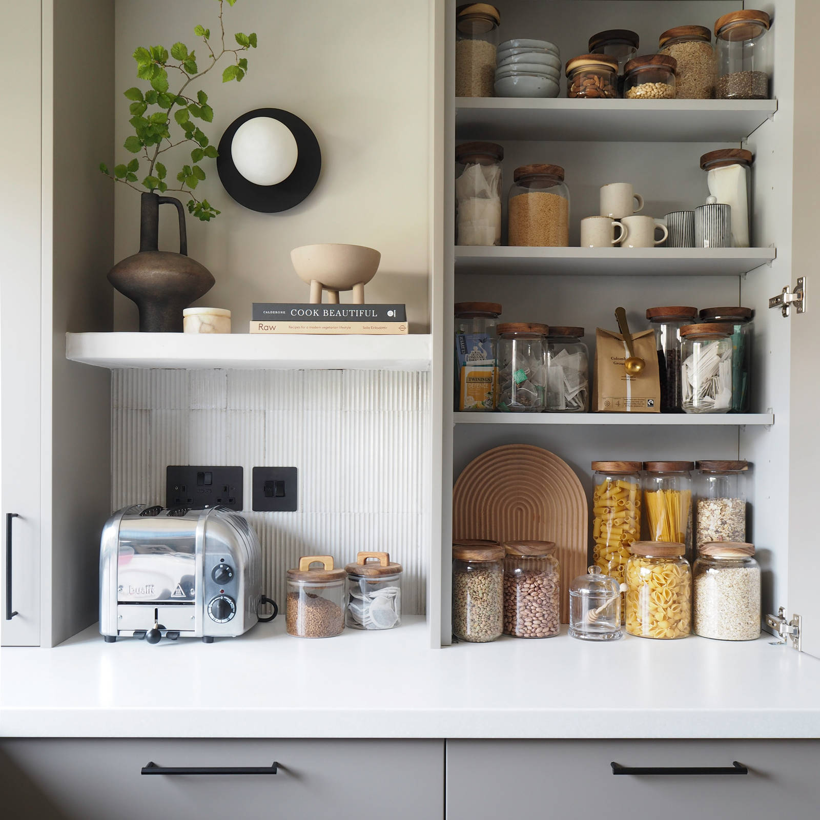Soho kitchen in neutral shade with opened pantry