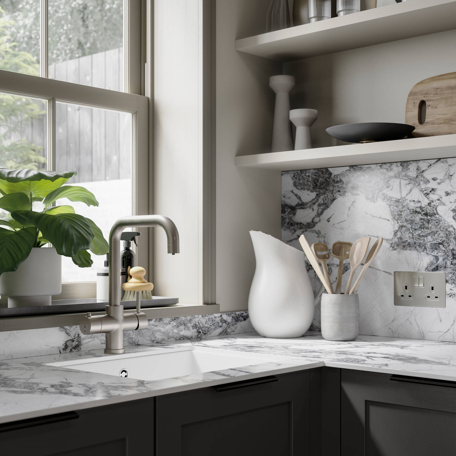 Close-up of marble worktop and backsplash in dark grey shaker kitchen.
