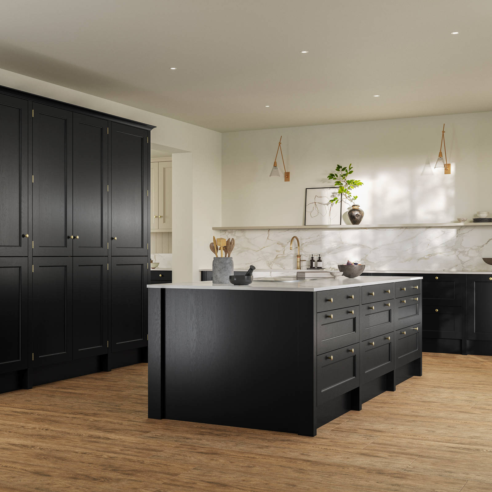Traditional Shaker-style tactile woodgrain Ludlow Sumi Black kitchen with tall cabinets and kitchen island, brass accessories, marbled white and grey worktop, Amtico oak stripwood vinyl flooring.