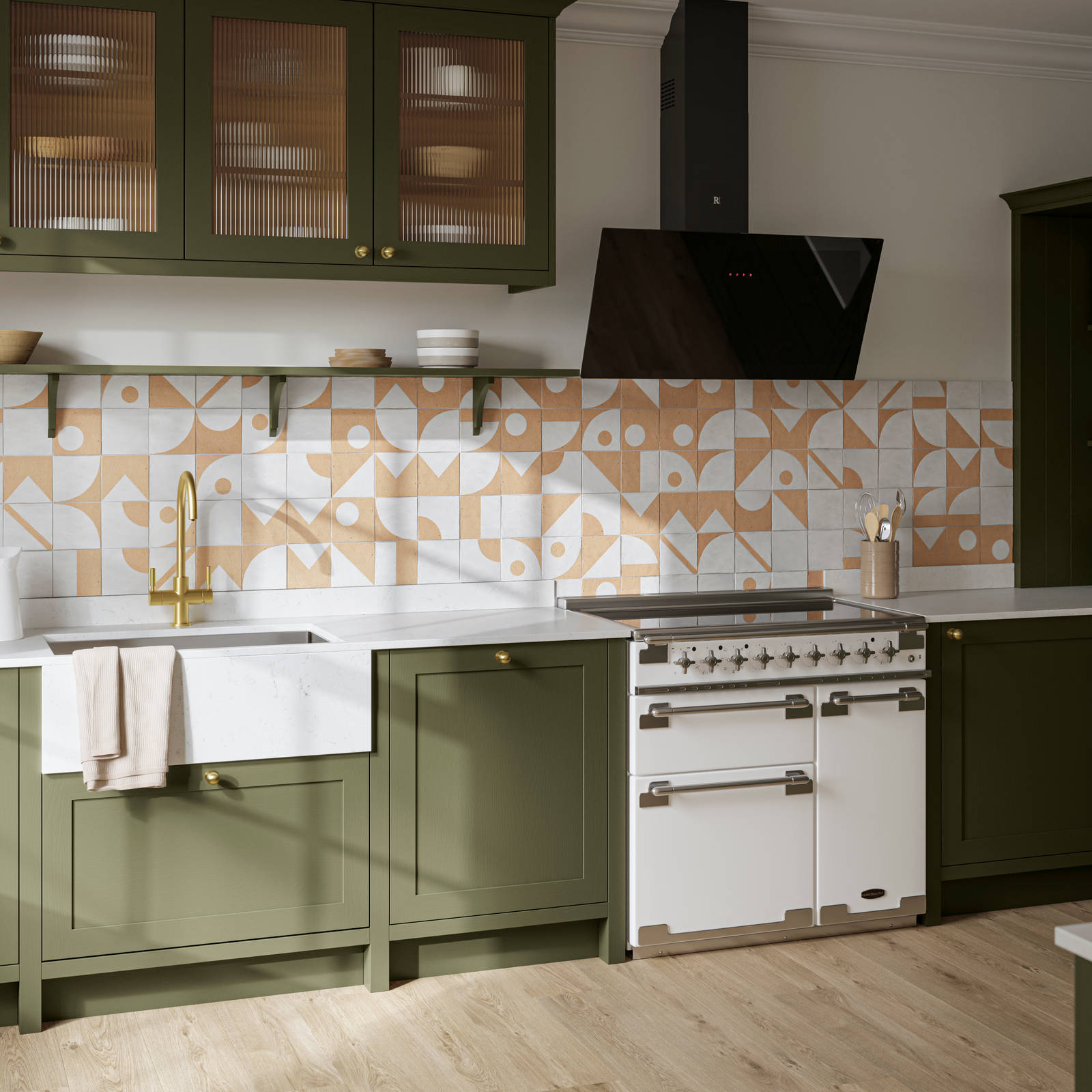 Premium Shaker kitchen Wardley Tailored green with traditional detailing, brass accessories, Elise range oven, screen extractor, white worktop and Classic Flint Grey oiled oak engineered wood flooring.