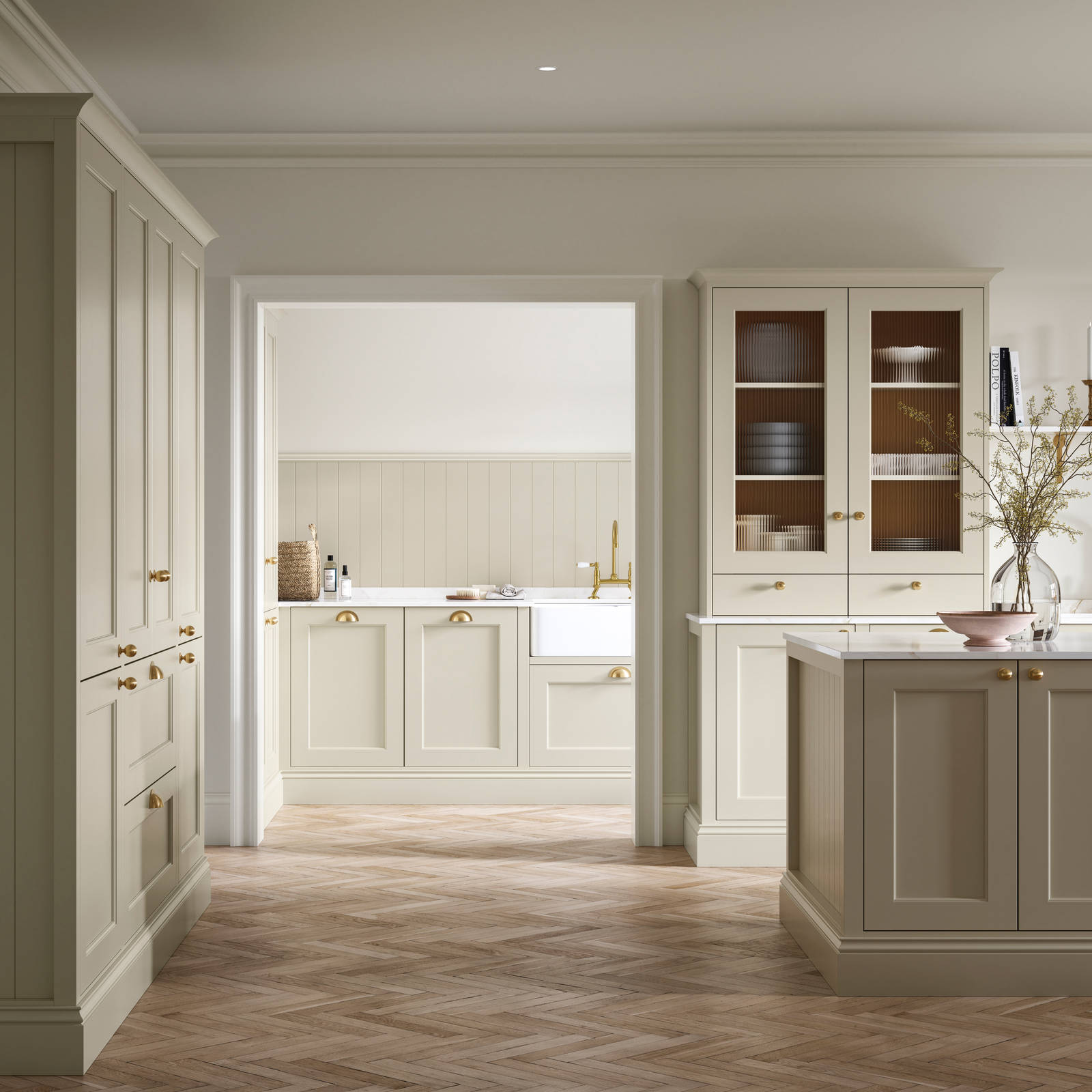 Open plan living room and Traditional Shaker-style kitchen Ludlow Parchment and view of utility room with white ceramic trough door frame, Goodrich Natural Oak herringbone engineered flooring, brass handles, brass knobs and bras tap.