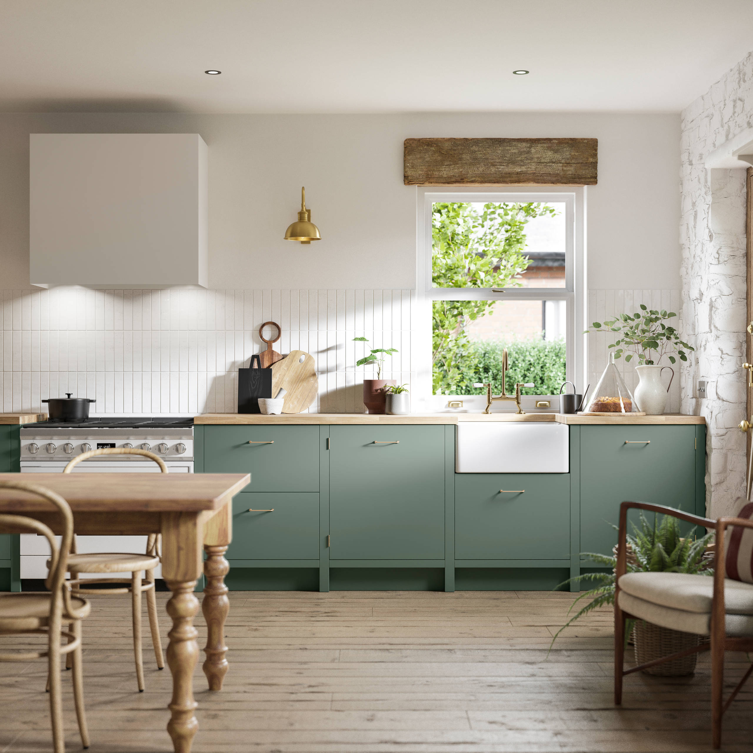 Soho Eucalyptus green open plan kitchen in contemporary cottage with a light wood dining table.