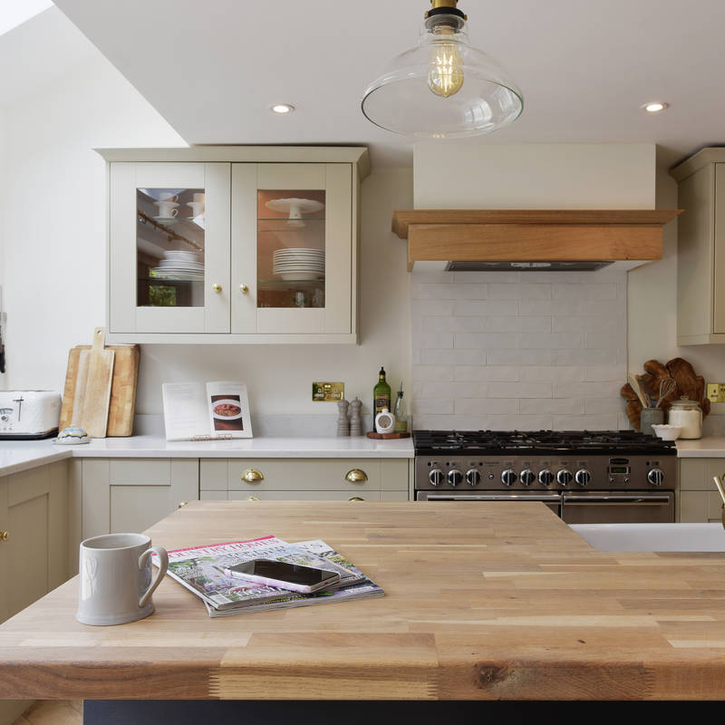 View from the kitchen island of the cabinets with antique brass cup handles.
