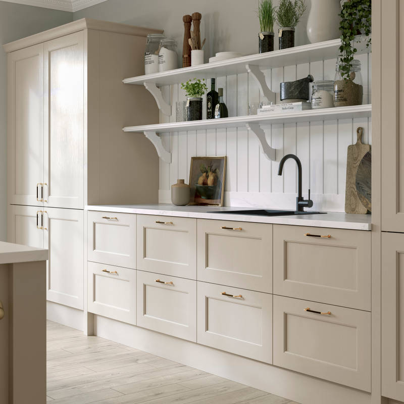 Ludlow kitchen, a Shaker door with a modern country-style in the neutral shade Pebble path paired with white open shelves and wall panelling.