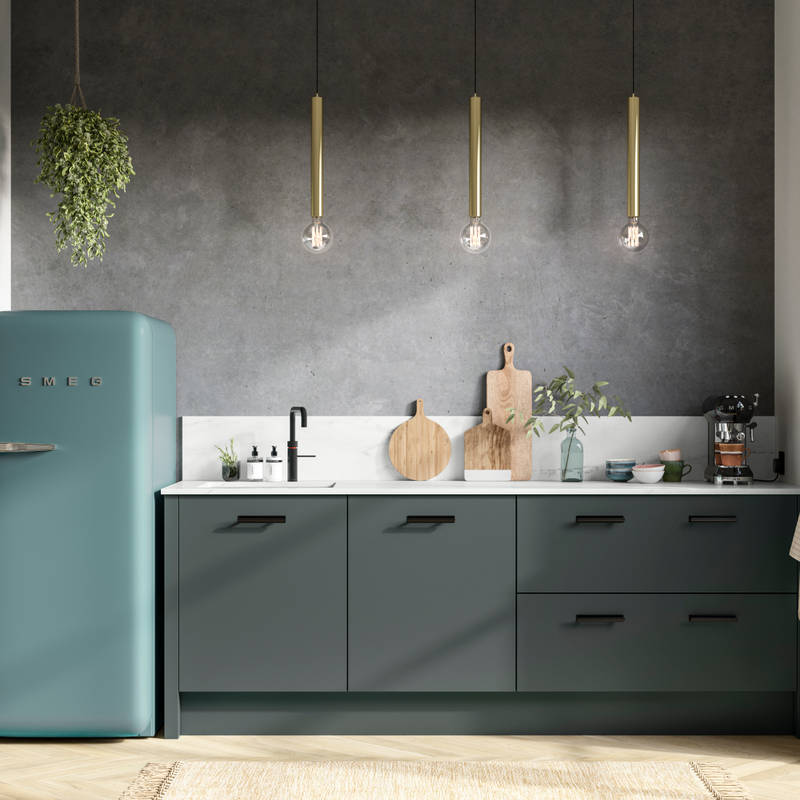 Straight view of modern Soho Arboretum kitchen with black tap and handles, dark grey marbled wall and blue Smeg fridge.