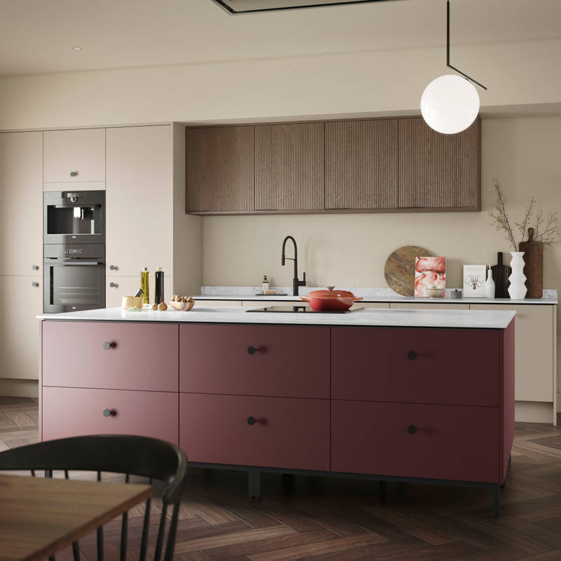 Soho kitchen in neutral color with Nordic Nature fluted wall cabinets and Burlington Red kitchen island, a painted premium slab door from Magnet.