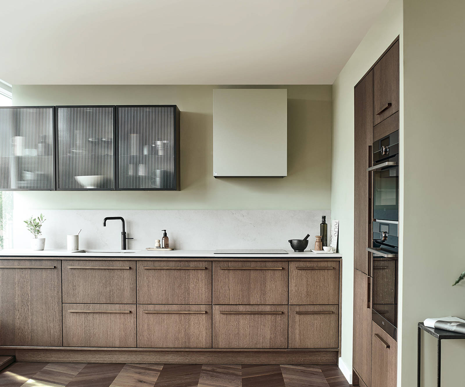 Nordic Nature. Modern wooden kitchen design with a Nordic influence. Featured floating worktops, a ribbed plinth and rounded end panels