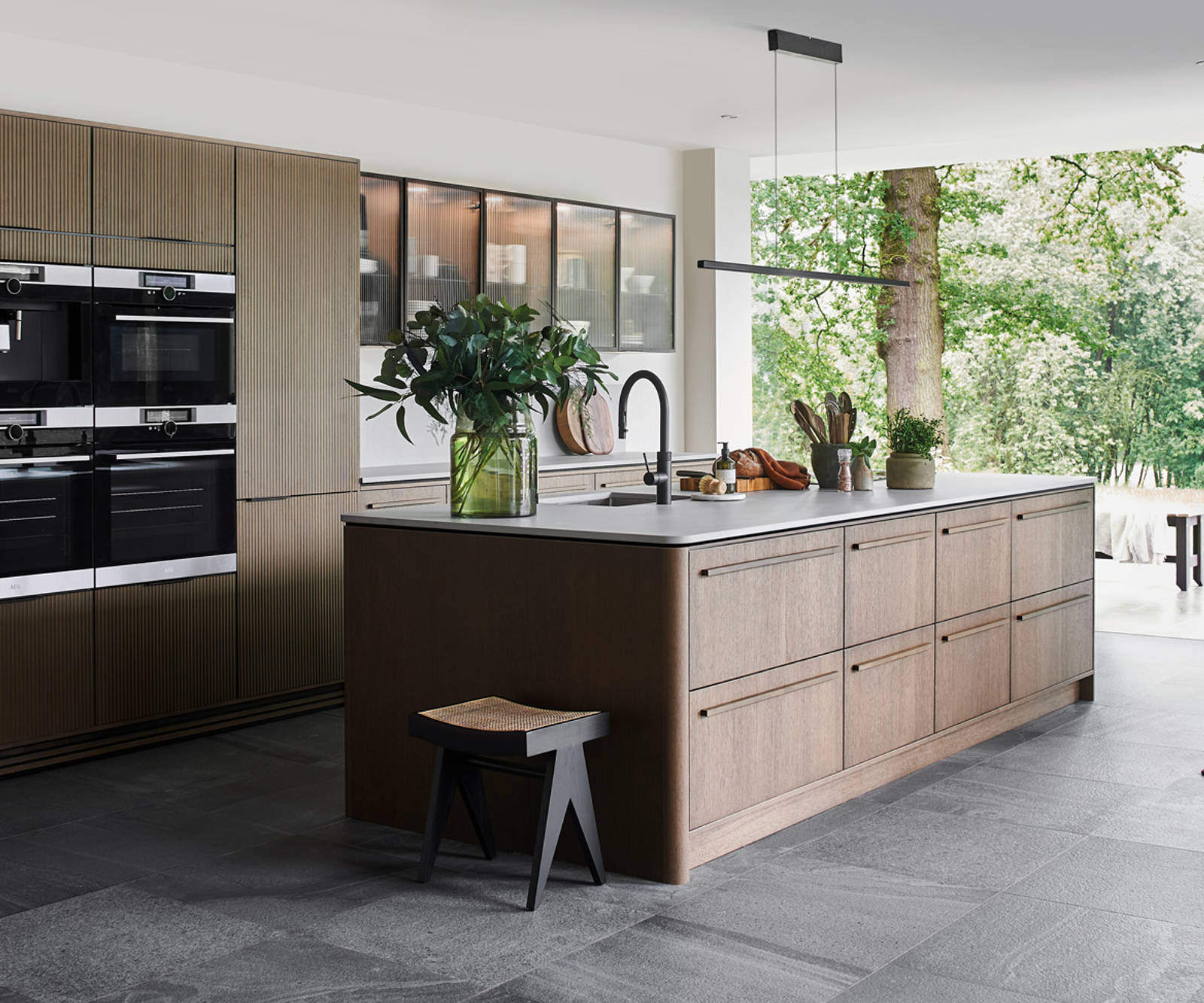 Nordic Nature. Modern wooden kitchen design with a Nordic influence. Featured floating worktops, a ribbed plinth and rounded end panels