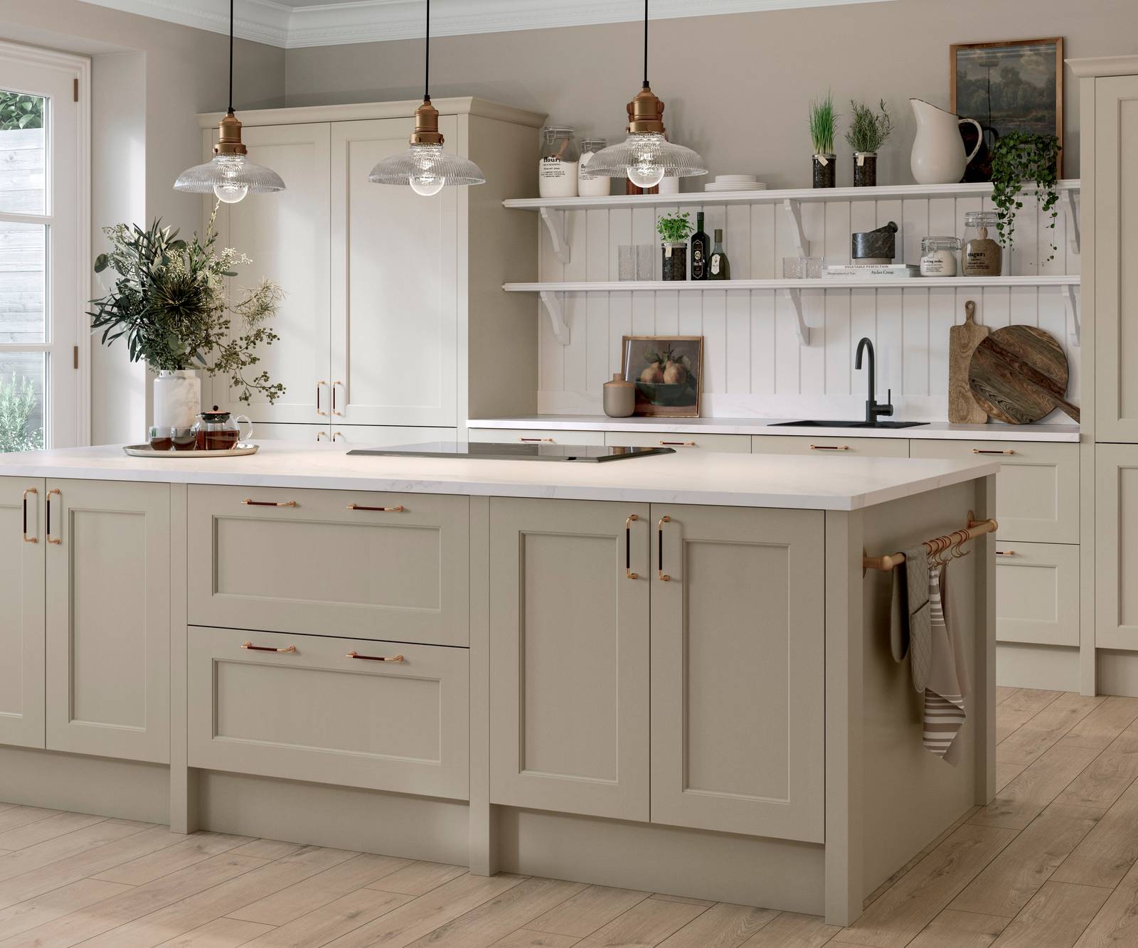 Ludlow Kitchen island and tall cabinets, a Shaker door with a modern country-style in the neutral shade Pebble path with a sleek light worktop and wooden floors.