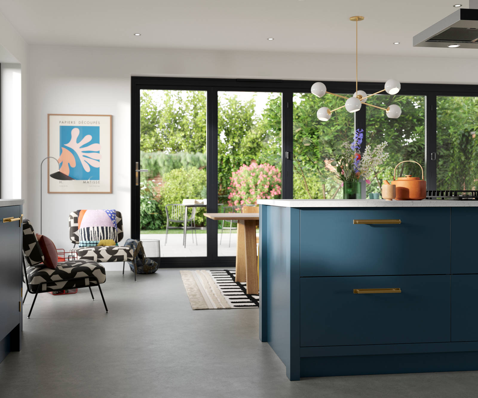 View of kitchen island in Soho Voyage Blue kitchen  with brass handles.