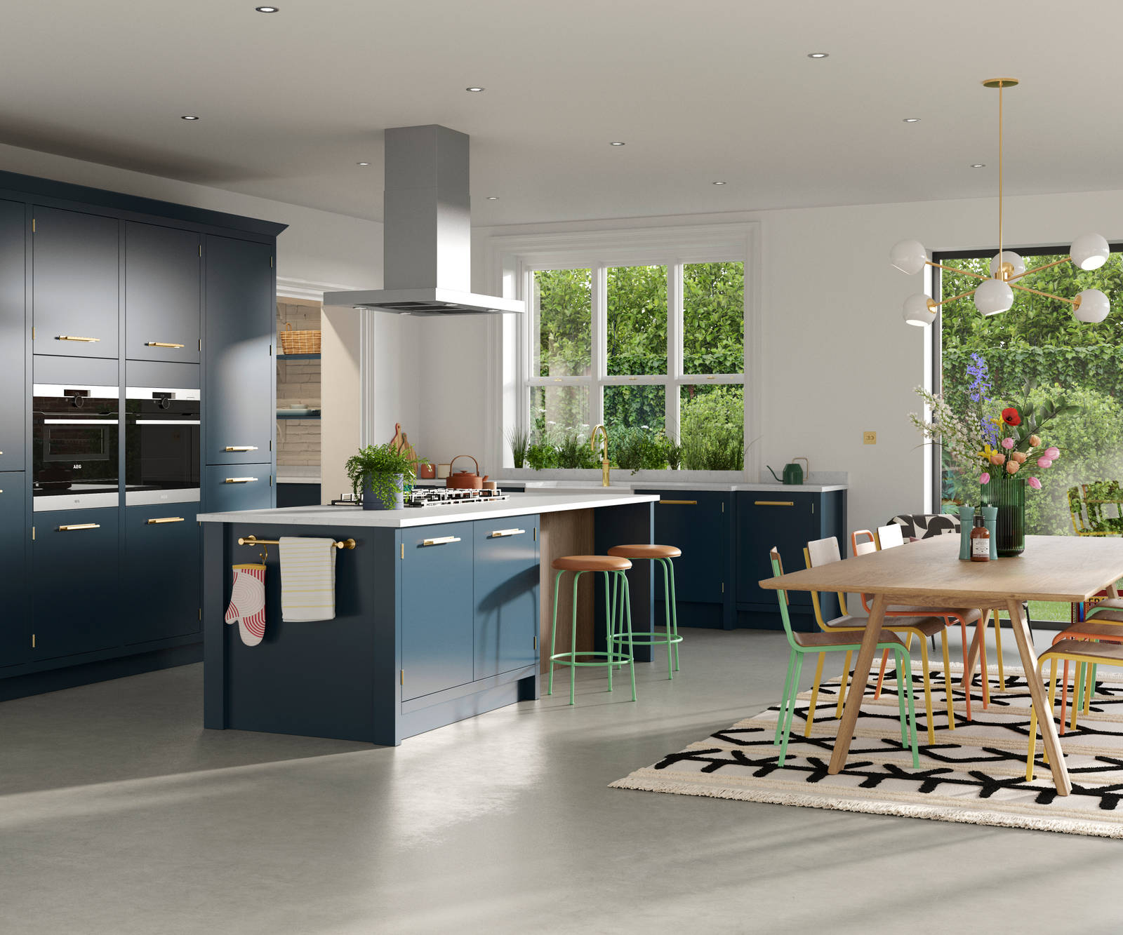 Full room view of Soho Voyage Blue kitchen with contemporary dining room table and chairs in bright colours.