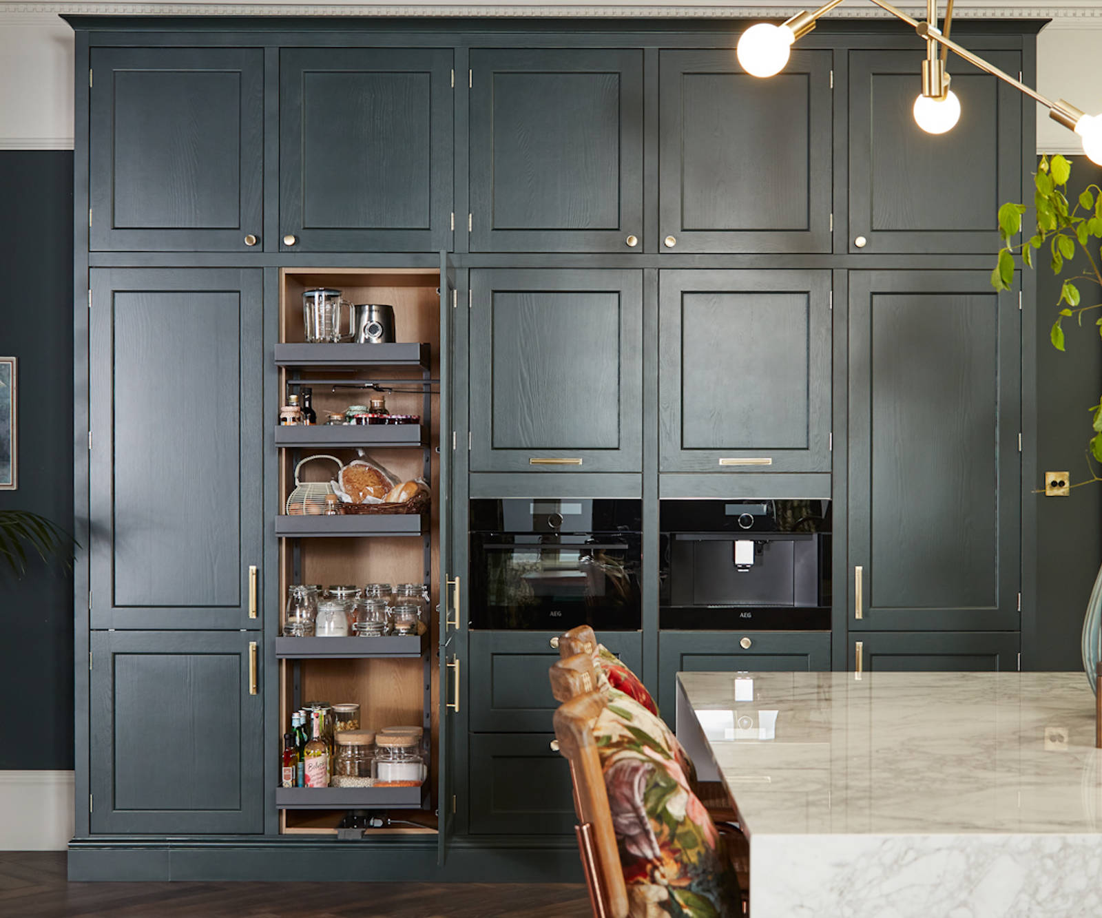 Ludlow, a traditional Shaker-style kitchen range in the shade Arboretum Green, kitchen larder.