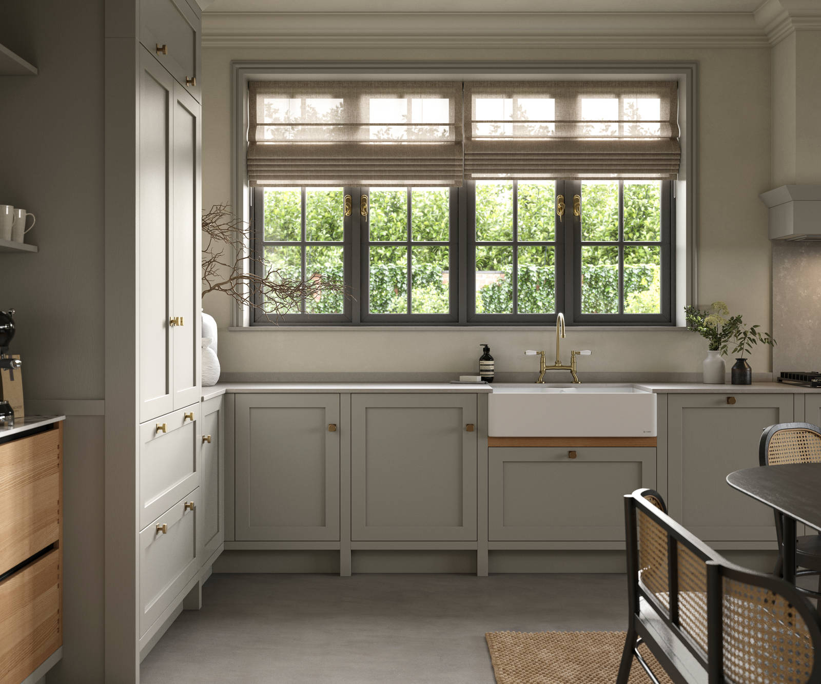 A neutral Shaker kitchen with Pebble and Nordic Craft cabinetry, belfast sink and traditional style tap.