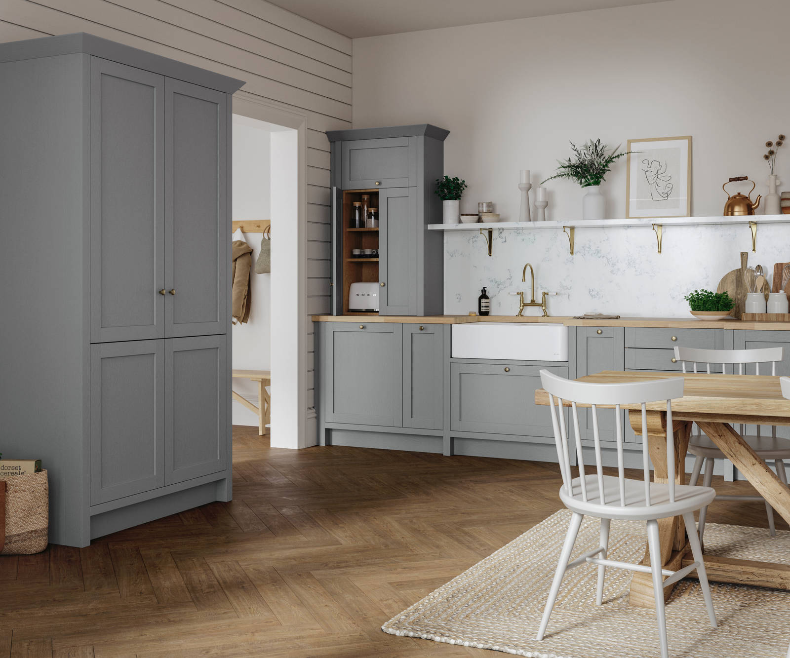 A grey Shaker Ambleside kitchen with a traditional wooden dining table and wooden flooring.