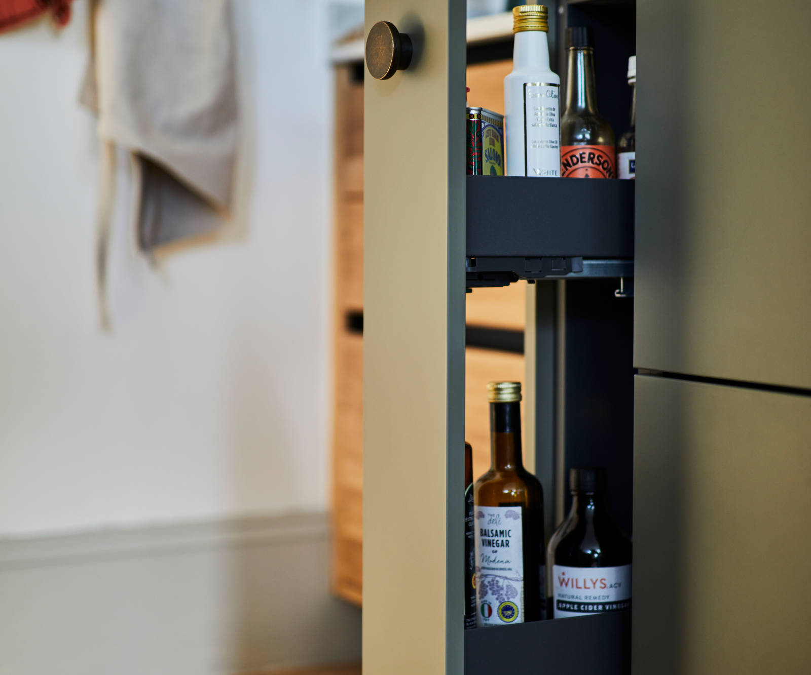Modern slab Soho cabinets in the Balmoral colour, a soft beige green tone