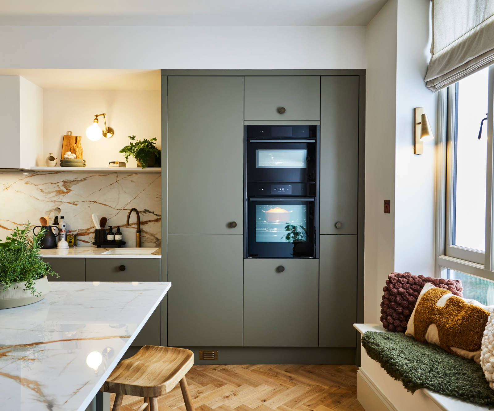 Modern slab Soho cabinets in the Balmoral colour, a soft beige green tone