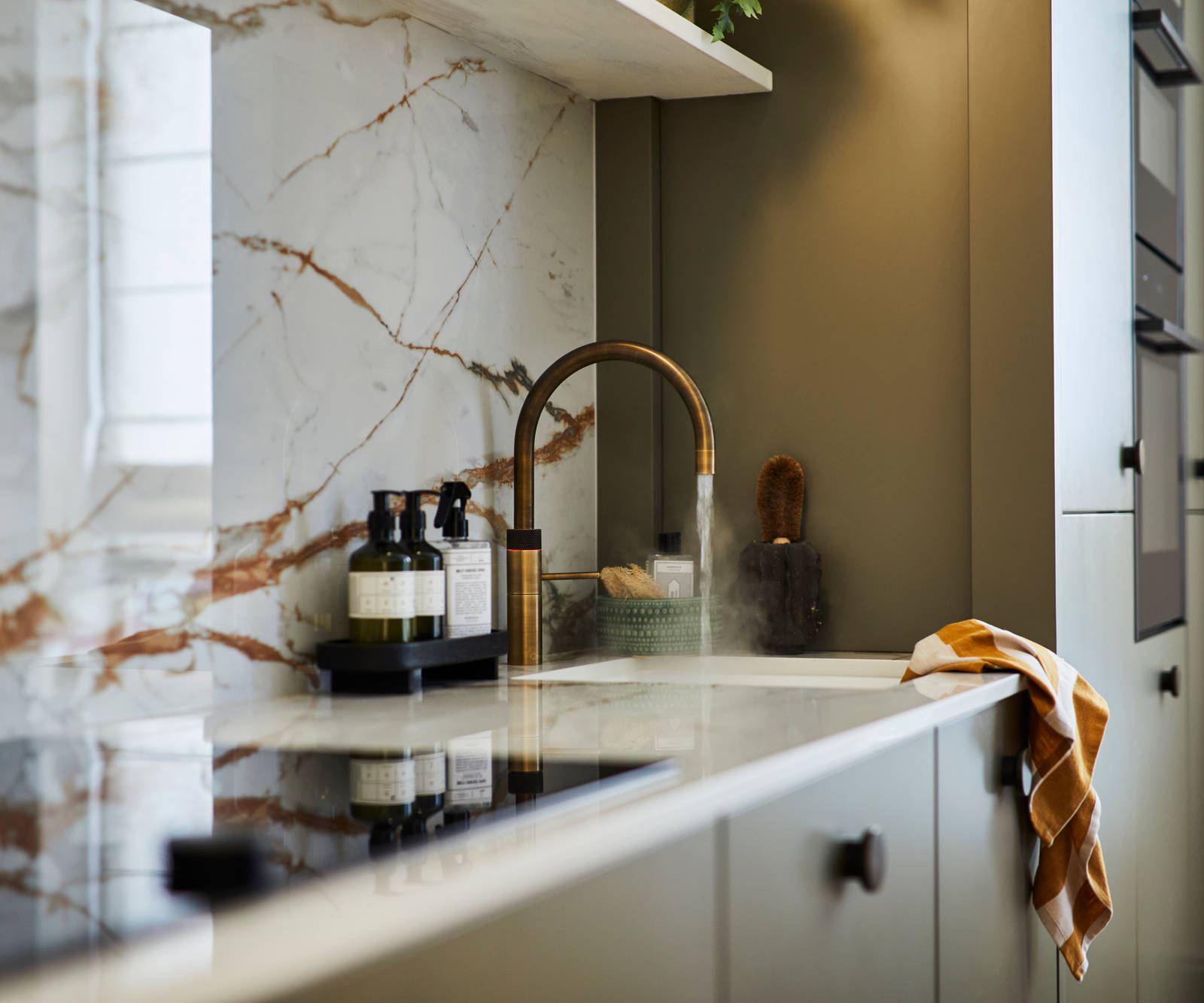 Modern slab Soho cabinets in the Balmoral colour, a soft beige green tone