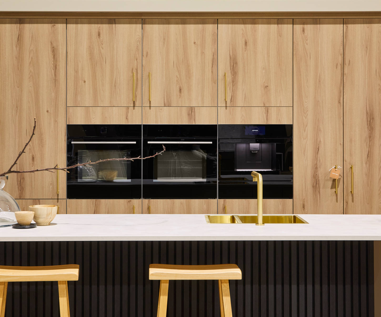Contemporary clean lines and organic woodgrain texture in an elegant kitchen range designed for modern living.
