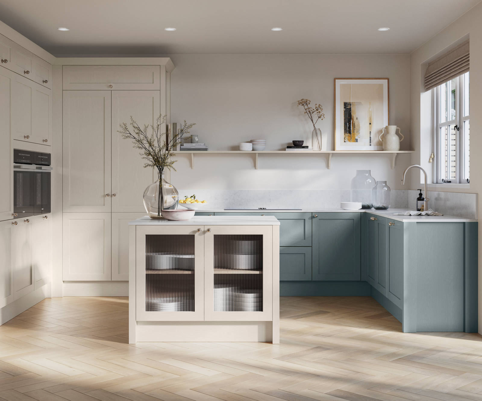 Open floorplan kitchen with small kitchen island in Wardley kitchen from Magnet in the light shade Limestone as well as blue Duck egg, decorated with flowers in glass vases and earth toned ceramics.