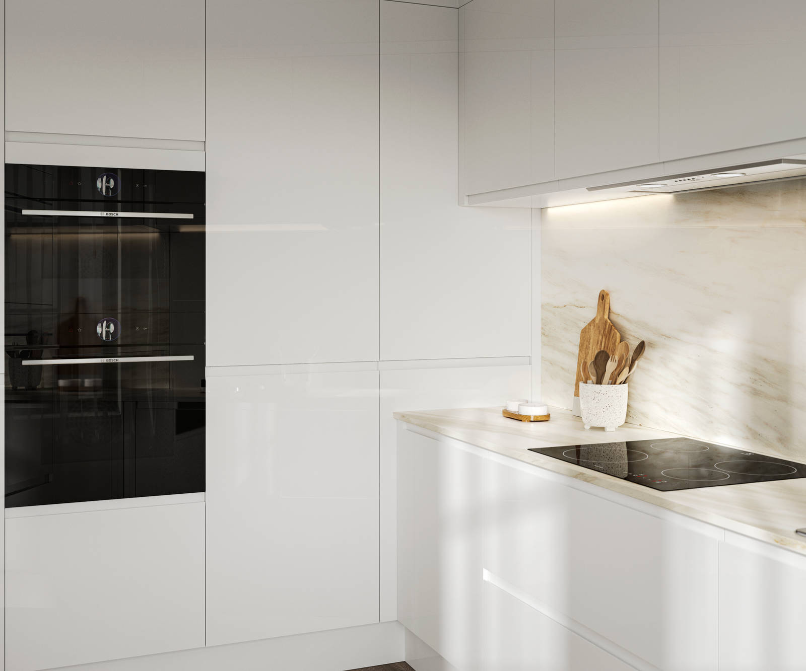 Handleless white gloss Luna kitchen from Magnet, with built-in ovens in tall cabinets.