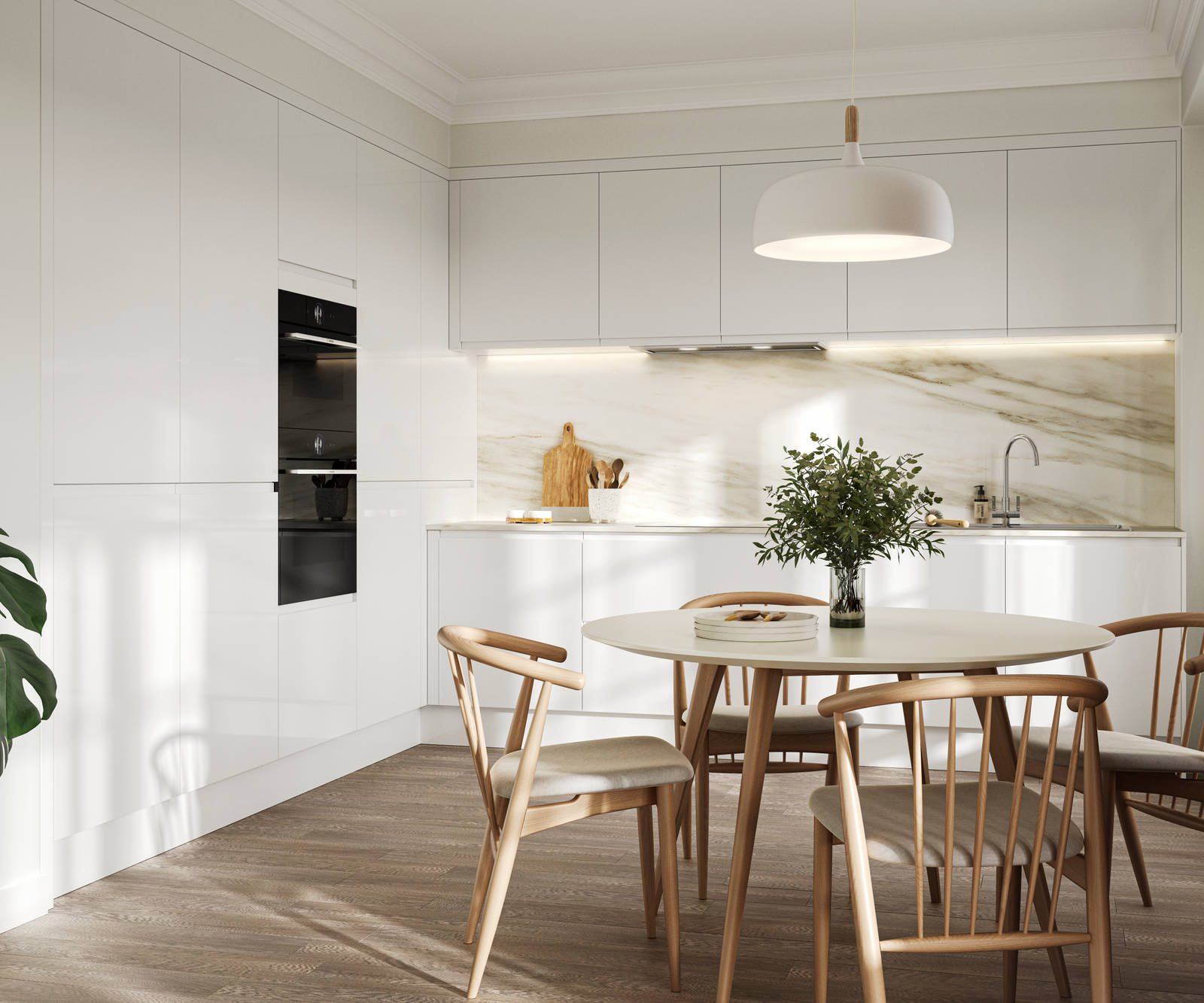 Handleless white gloss Luna kitchen from Magnet, light wood kitchen table with matching chairs and plants