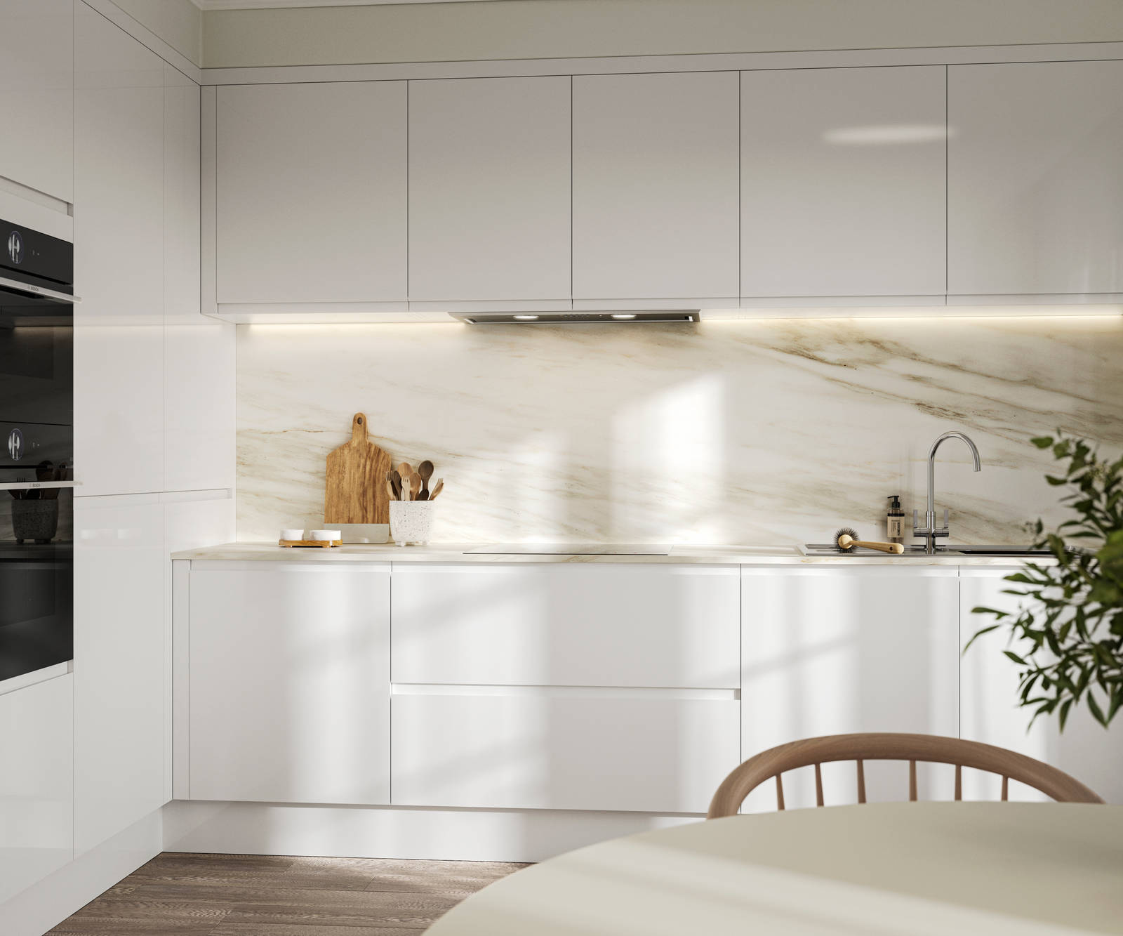 Handleless white gloss Luna kitchen from Magnet, with a white marbled worktop and backsplash.