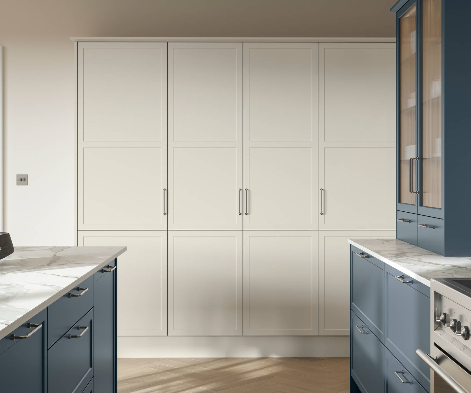 Modern Shaker kitchen Brunswick with kitchen island in shade Voyage Blue and tall cabinetry in shade Limestone, white and grey marbled worktop and steel handles.