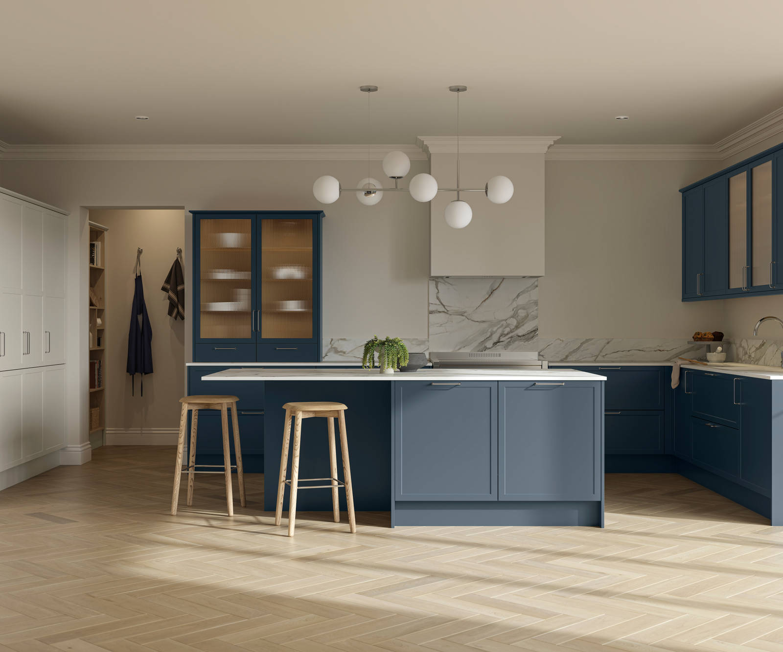 Modern Shaker kitchen Brunswick Voyage blue and Limestone with white and grey marbled worktop and matching splashback, a kitchen island with light wood stools at breakfast bar and vitrine cabinets with fluted glass, light wood herringbone flooring.