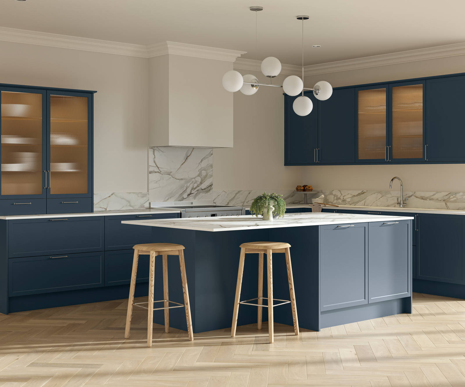Modern Shaker kitchen Brunswick Voyage blue with white and grey marbled worktop and matching splashback, a kitchen island with breakfast bar and vitrine cabinets with fluted glass, and light wood herringbone flooring.