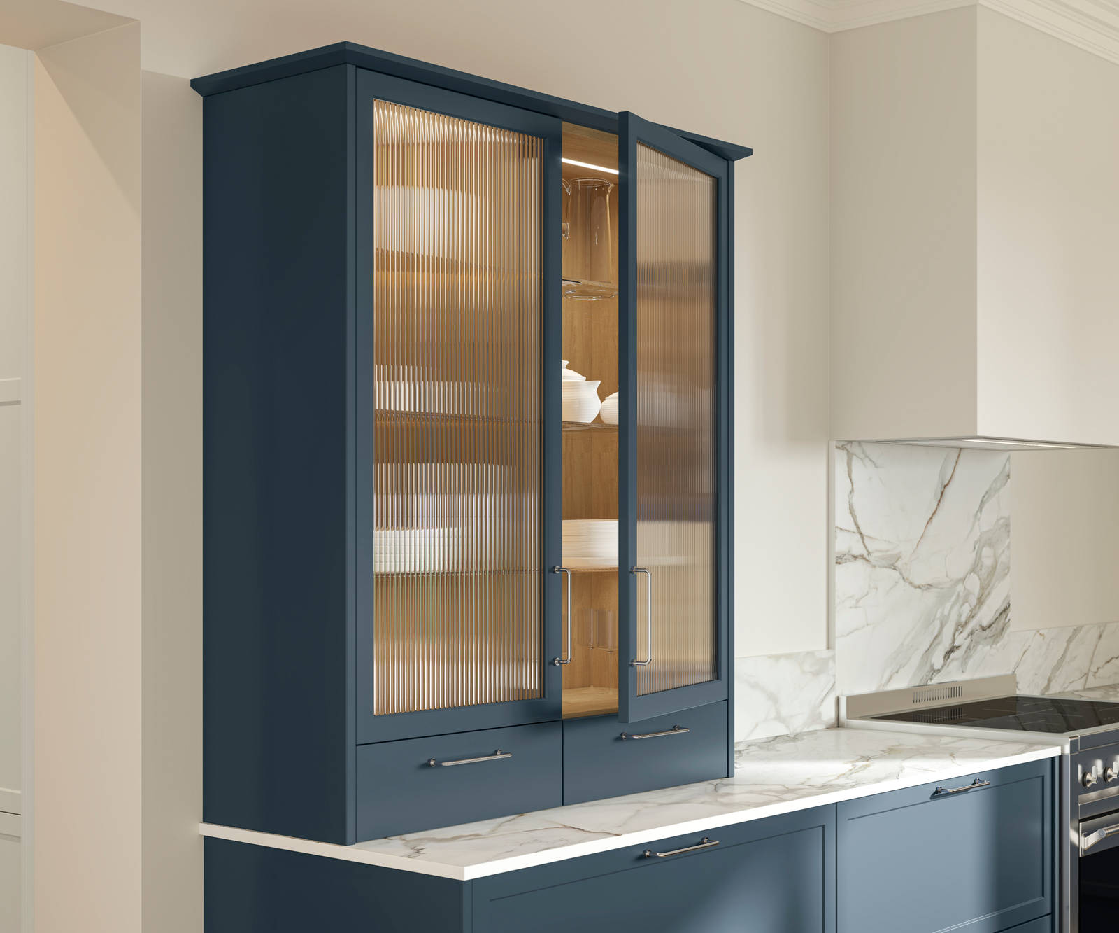 Opened vitrine cabinet with fluted glass in modern Shaker kitchen Brunswick Voyage blue, paired with a white and grey marbled worktop, matching splashback and steel handles.