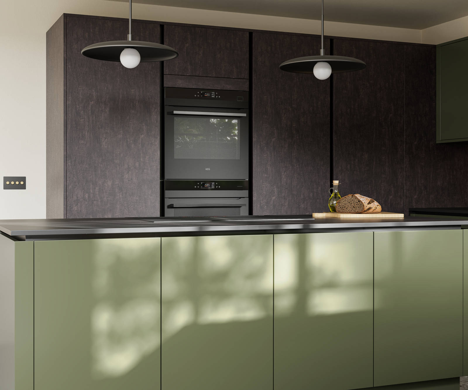 Integra Soho Tailored Green kitchen and kitchen island with contrasting dark wood Portobello Etna and black accessories, integrated ovens in tall cabinets, Dekton worktop and fluted glass vitrin wall cabinets.